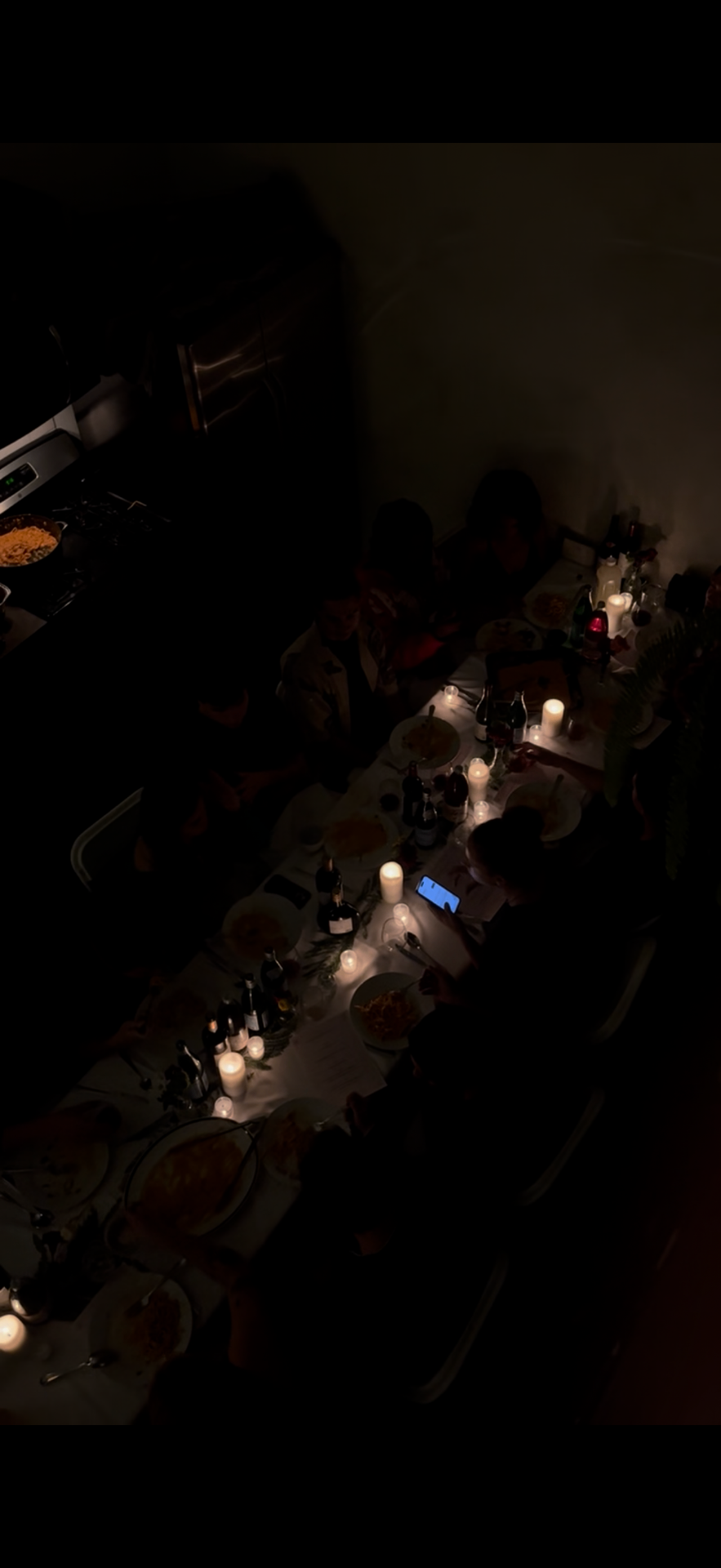 Dimly lit communal dinner captured from above at a Frontier NYC event